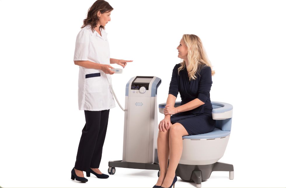 Patient seated during Emsella pelvic floor strengthening treatment