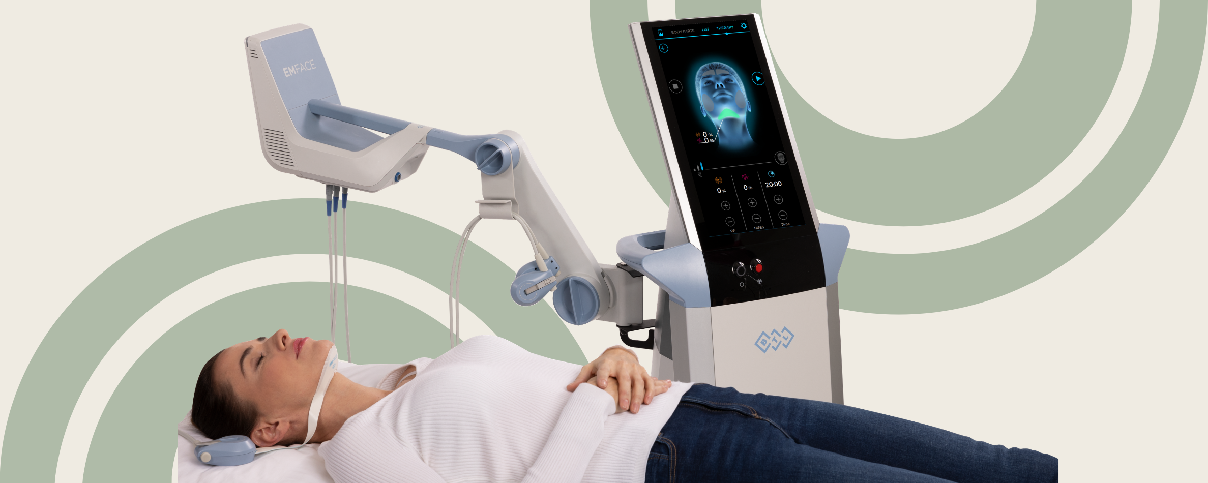 Patient receiving Emface treatment while lying comfortably in a treatment room