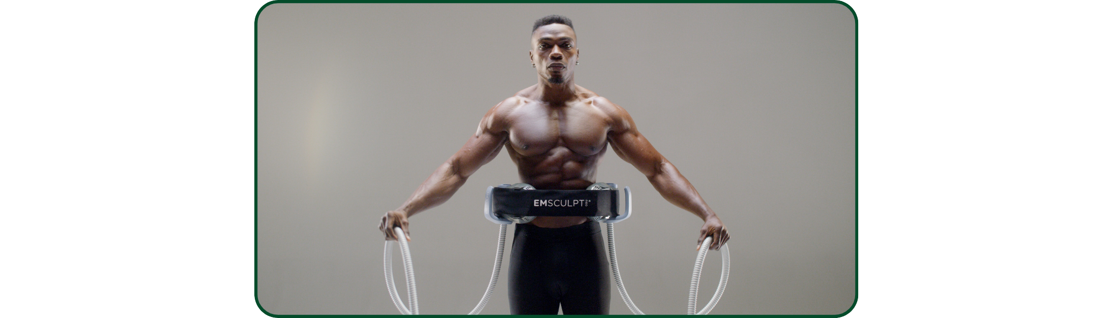Athletic male demonstrating muscle definition achievable with Emsculpt Neo treatment