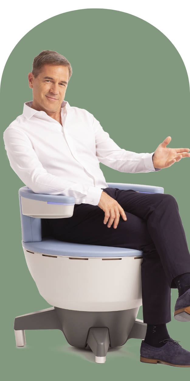 Man seated on the Emsella chair for non-invasive pelvic floor strengthening treatment